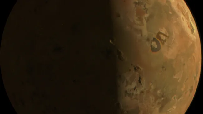 Jupiter's volcanic moon Io looks outstanding in these close flyby photos from NASA's Juno probe
